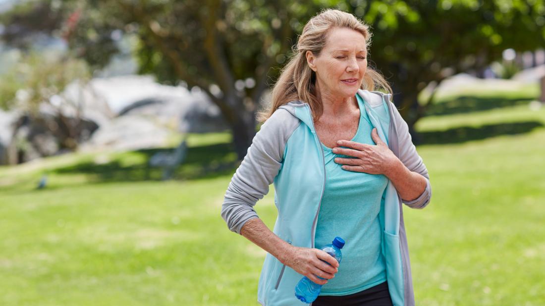 a female runner experiencing shortness of breath because of cardiomyopathy